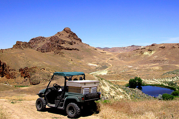 This is truely an oasis as the water of this lake is as blue & clear as the waters off Kauai.  Very unusual for the Owyhee desert.  Most lakes are very alkoline and have the appearance of chocolate milk.  Our hunt is some 10 more miles over the distant horizon.