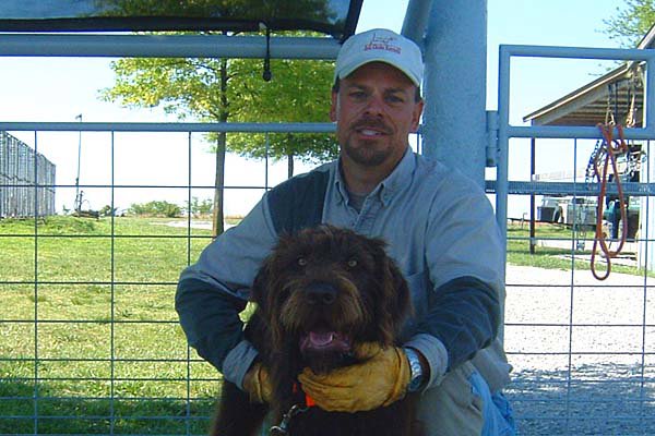 Ronnie Smith with the  Cedarwood dog belonging to Joe Westervelt on his last day of training at the Smith training facilities in Oklahoma.  The boys probably didnt inform Delmar that a pudelpointer had now invaded the training facilities.