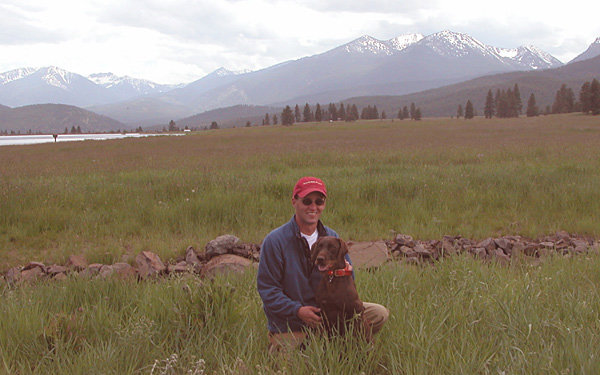 Monty Rist with his Cedarwoods pudelpointer following a NAVHDA test in Oregon after earning a natural ability Prize I perfect score of 112.