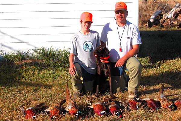 Jim Reis and his son Cody following a good morning's hunt in North Dakota over their one year old pudelpointer., When Firestone brought Mario Andretti to Boise for a promotion for their tires, they asked him if he'd like to see the Boise State Bronco's Blue Turf.  The Smurf Turf.  He wasnt interested in the turf, but he did want to meet that dog he saw on television retrieving the kicking T.