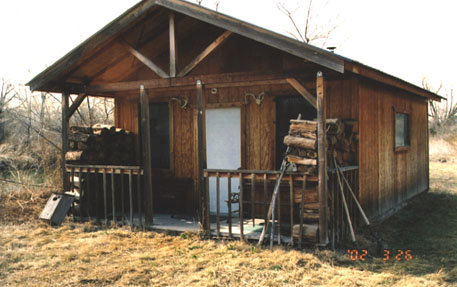 The Swamp has a one room "Shantee", complete with wood stove and solar powered 12 volt lighting.  The start and finish of many winter duck hunts take place inside these walls along with many summer training sessions and an occassional all night poker game.