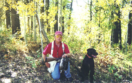 Bob and Cedarwoods Image of Jake (Jessie) in McCall with a couple of Ruffs taken on a hunt from the  family cabin's back door.
Idaho has untapped grouse hunting in many parts of the state with very few Idaho sportsmen taking advantage of Americas best eating bird.