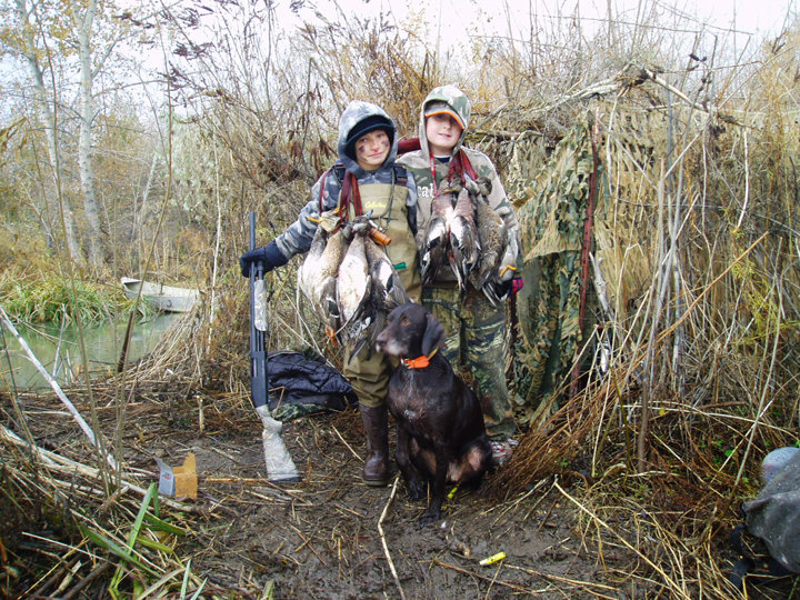 Hunter and Brett with Cedarwoods A Cup Playgirl crawling out of the blind following a successful day's hunt.